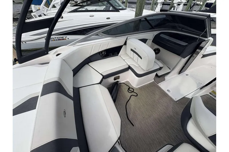 Slide: The Image of 2018 Regal 21 OBX boat interior with white seating and modern design. - 9