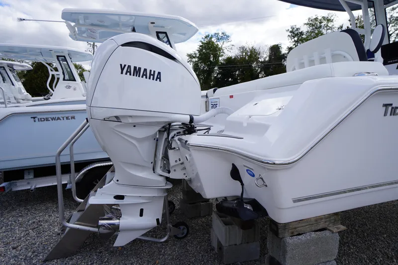 Slide: The Image of 2026 Tidewater 232 LXF boat with Yamaha outboard motor on display. - 2
