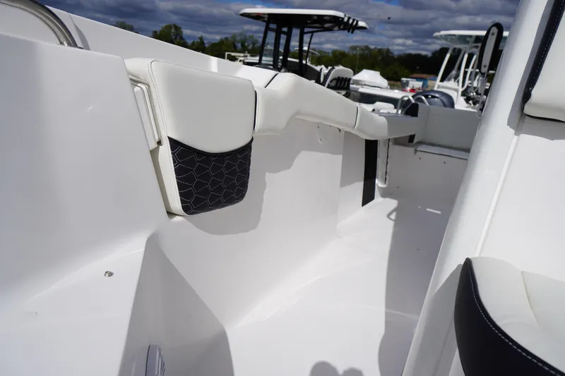 Slide: The Image of 2026 Tidewater 232 LXF boat interior, showcasing sleek white design and modern seating. - 30