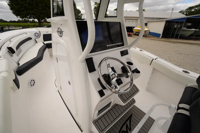 Slide: The Image of 2026 Tidewater 232 LXF boat interior with modern helm and seating. - 32