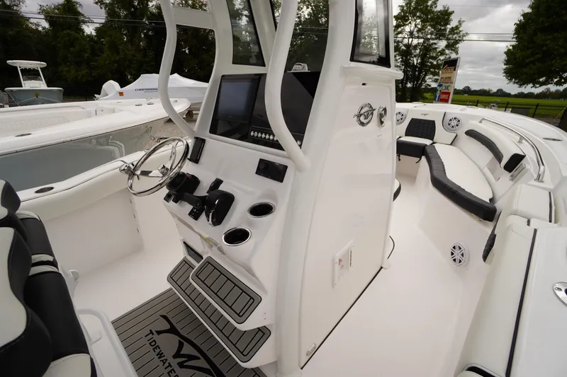 Slide: The Image of 2026 Tidewater 232 LXF boat interior with modern helm and seating. - 33