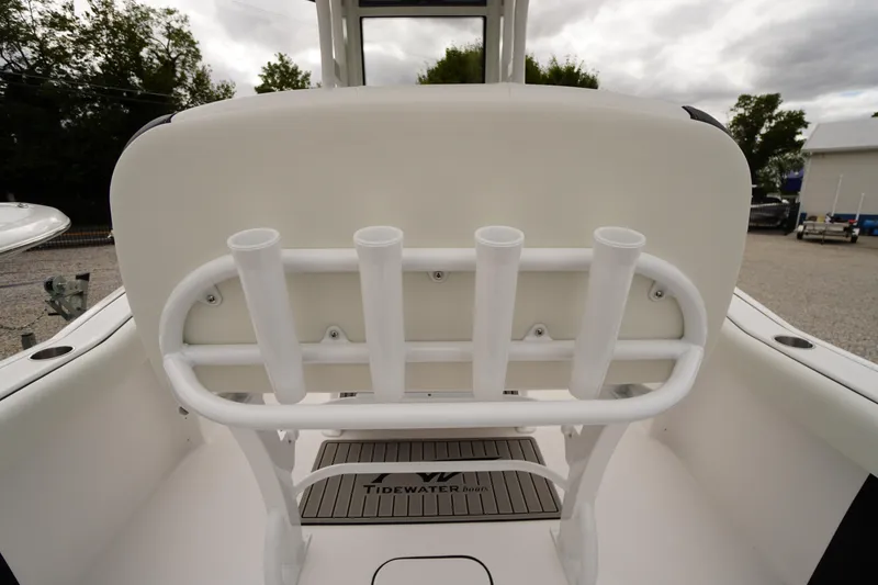 Slide: The Image of 2026 Tidewater 232 LXF boat interior with rod holders and branded flooring. - 40