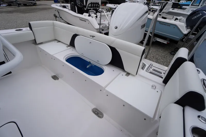 Slide: The Image of 2026 Tidewater 232 LXF boat interior with seating and storage compartments. - 47