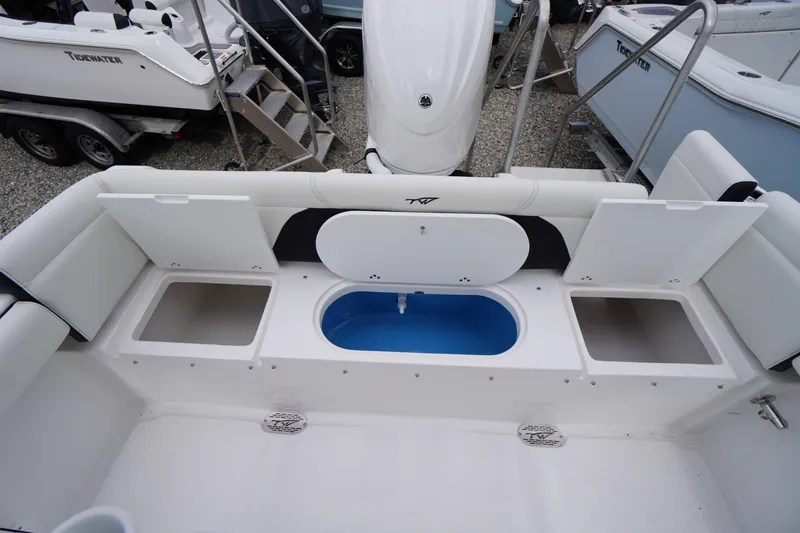 Slide: The Image of 2026 Tidewater 232 LXF boat interior with storage compartments and seating. - 49