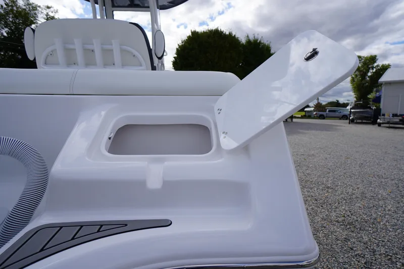 Slide: The Image of 2026 Tidewater 232 LXF boat storage compartment with open hatch, showcasing sleek design. - 50