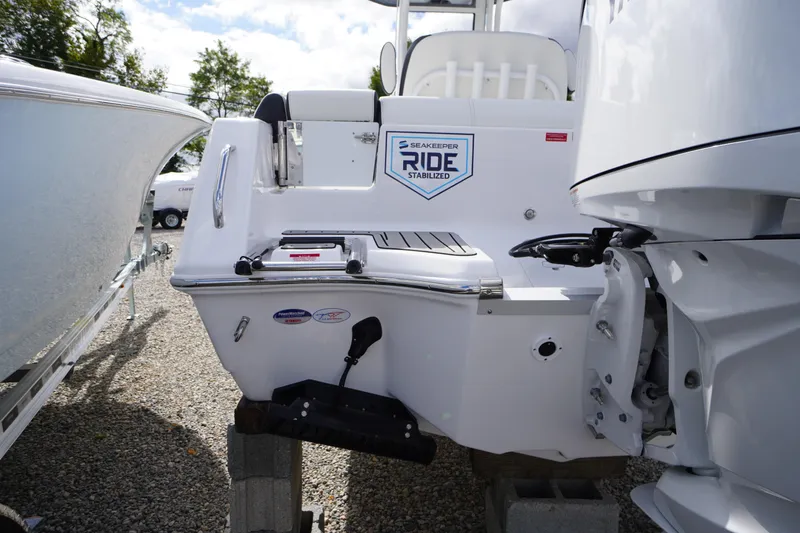 Slide: The Image of 2026 Tidewater 232 LXF boat with Seakeeper Ride stabilization, displayed outdoors. - 51