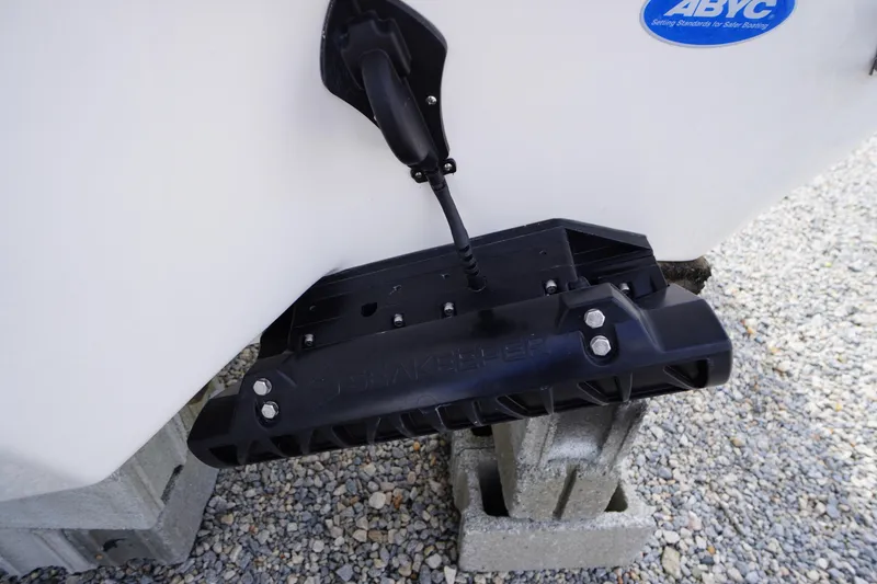 Slide: The Image of 2026 Tidewater 232 LXF boat with transducer mounted on hull, resting on blocks. - 52