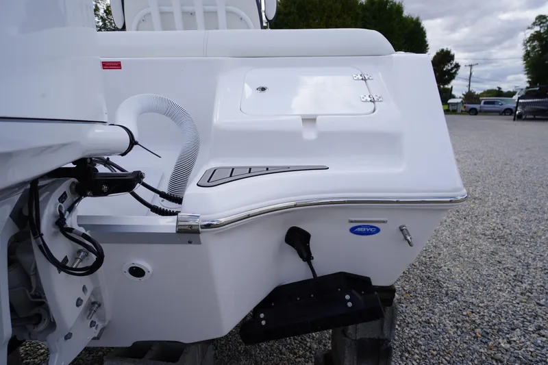 Slide: The Image of 2026 Tidewater 232 LXF boat stern view with white finish and hardware details. - 53
