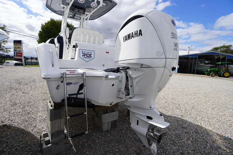 Slide: The Image of 2026 Tidewater 232 LXF boat with Yamaha engine on display outdoors. - 54