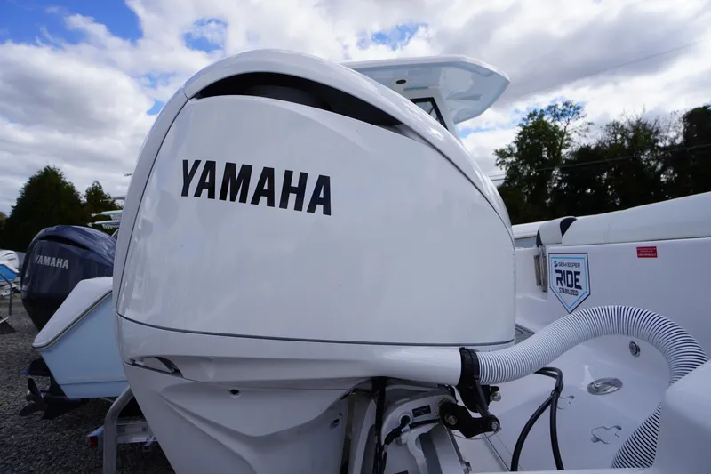 Slide: The Image of 2026 Tidewater 232 LXF boat with Yamaha engine, featuring Seakeeper Ride stabilization. - 58