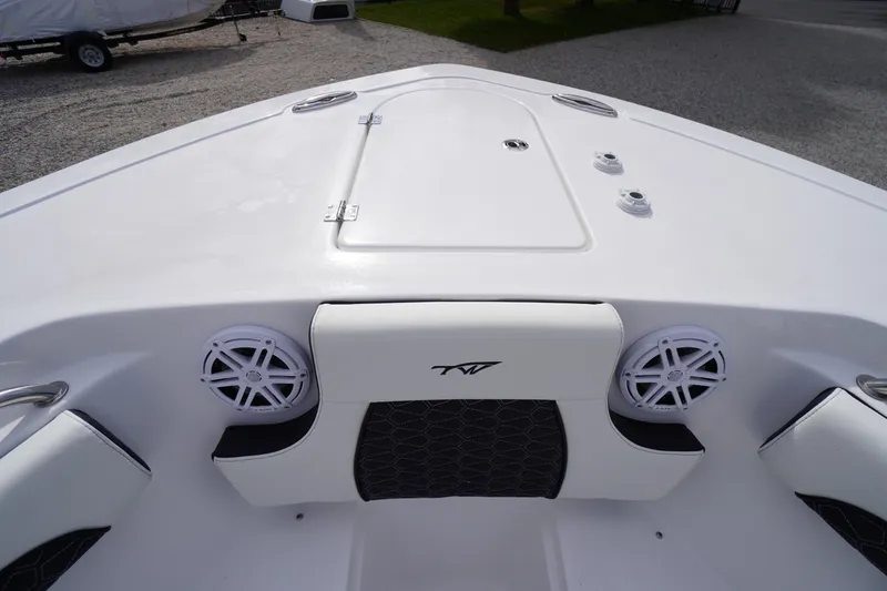 Slide: The Image of 2026 Tidewater 232 LXF boat interior with speakers and storage compartment. - 7
