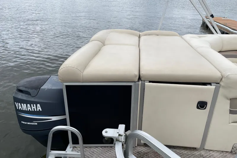 Slide: The Image of 2005 Bennington 2275RL pontoon boat with Yamaha outboard motor on a calm lake. - 8