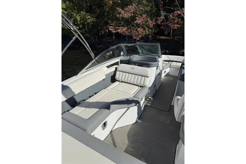 Slide: The Image of 2017 Cobalt 24SD boat interior with plush seating and sleek design. - 10