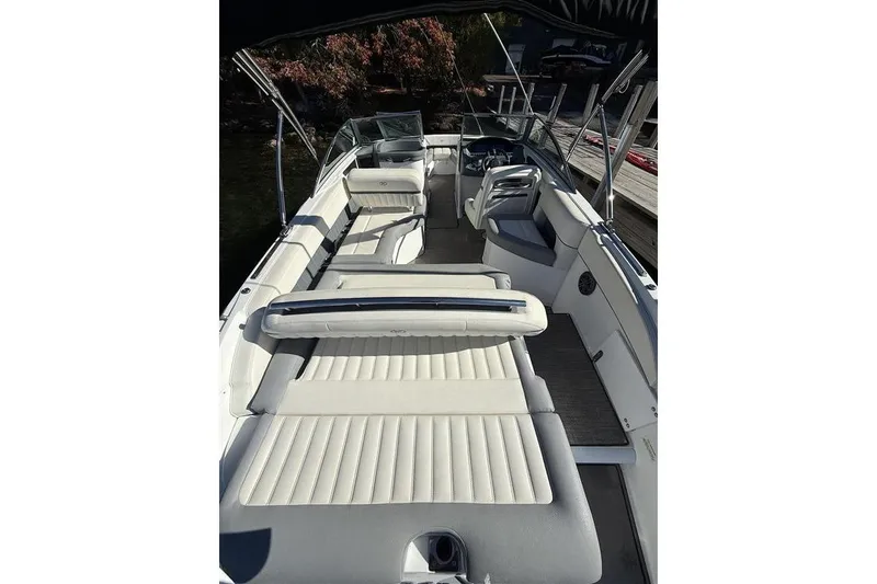 Slide: The Image of 2017 Cobalt 24SD boat interior with spacious seating and sleek design. - 11