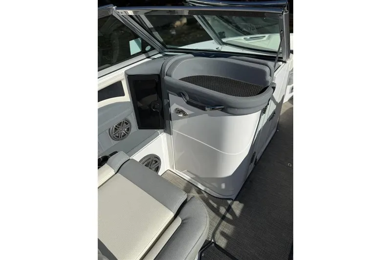 Slide: The Image of 2017 Cobalt 24SD boat interior with seating and storage compartments. - 15