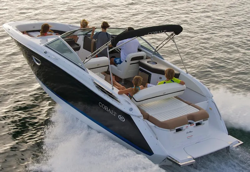 Slide: The Image of Manufacturer Provided Image: 2017 Cobalt 24SD boat cruising with passengers on a sunny day. - 27