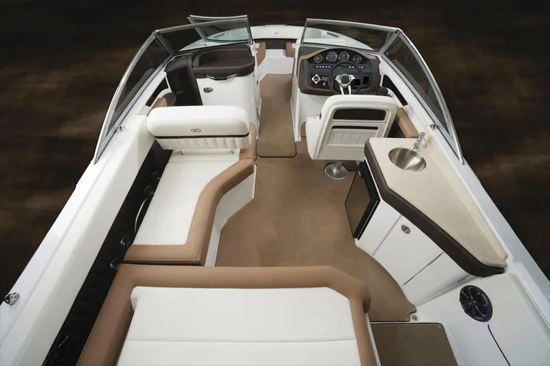 Slide: The Image of Manufacturer Provided Image: 2017 Cobalt 24SD boat interior with seating, steering console, and kitchenette. - 28