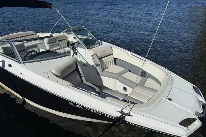Slide: The Image of 2017 Cobalt 24SD boat with sleek design, docked on clear water. - 6