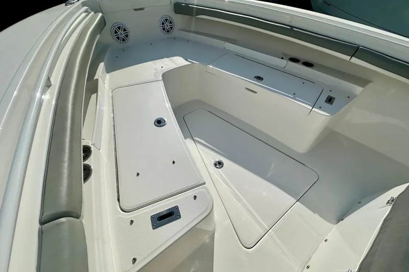 Slide: The Image of 2025 Regulator 23 boat interior with storage compartments and seating. - 15