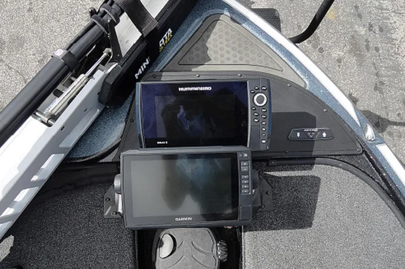 Slide: The Image of 2021 Nitro Z19 Pro boat dashboard with Humminbird and Garmin displays. - 15