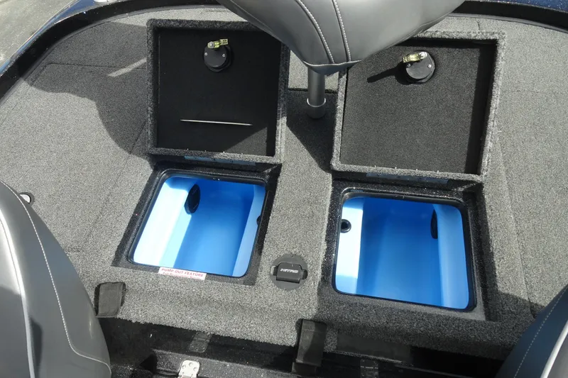 Slide: The Image of 2021 Nitro Z19 Pro boat storage compartments with blue interior and seating. - 17
