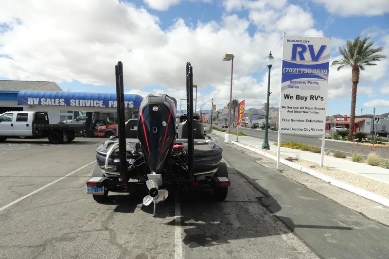 Slide: The Image of 2021 Nitro Z19 Pro boat parked near RV sales and service center. - 19
