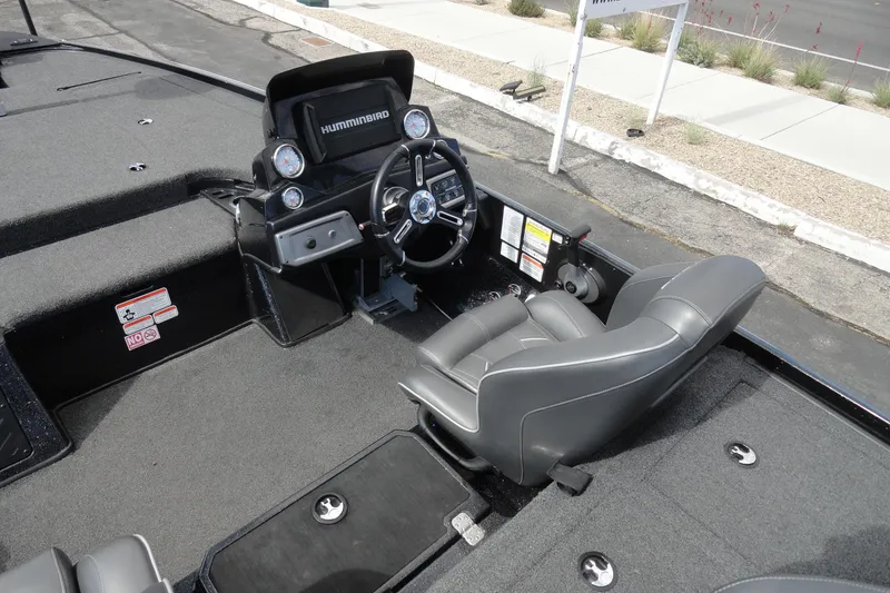 Slide: The Image of Interior of a 2021 Nitro Z19 Pro boat featuring a steering console and seating. - 7