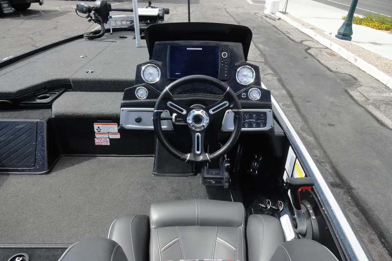 Slide: The Image of 2021 Nitro Z19 Pro boat cockpit with steering wheel and control panel. - 8