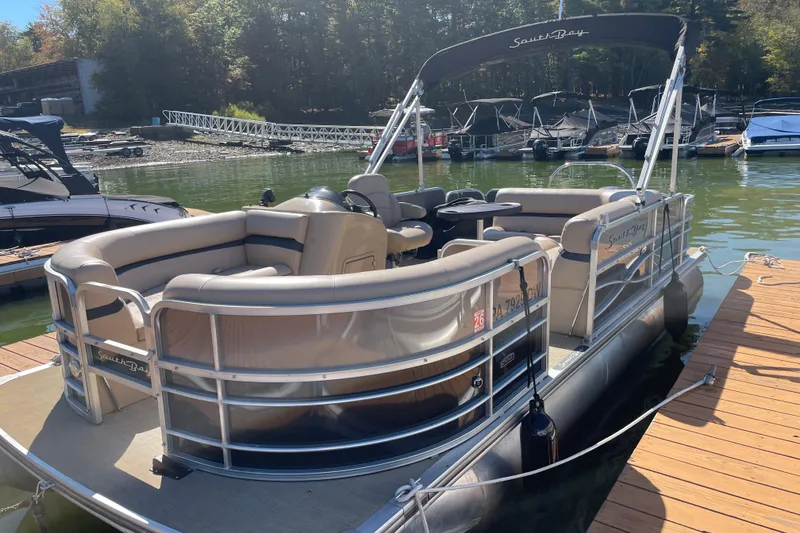 Slide: The Image of 2018 South Bay 222FLR pontoon boat docked on a sunny day. - 3