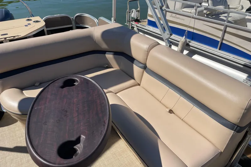 Slide: The Image of 2018 South Bay 222flr pontoon boat with beige seating and oval table. - 4