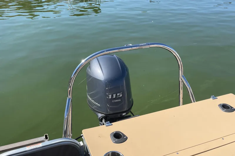 Slide: The Image of 2018 South Bay 222flr pontoon boat with Yamaha 115 outboard motor on calm water. - 6