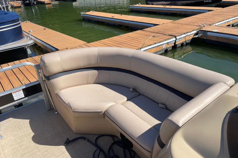 Slide: The Image of 2018 South Bay 222flr pontoon boat with beige seating at a dock. - 7