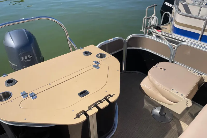 Slide: The Image of 2018 South Bay 222flr pontoon boat with Yamaha 115 engine, beige seating, and table. - 8