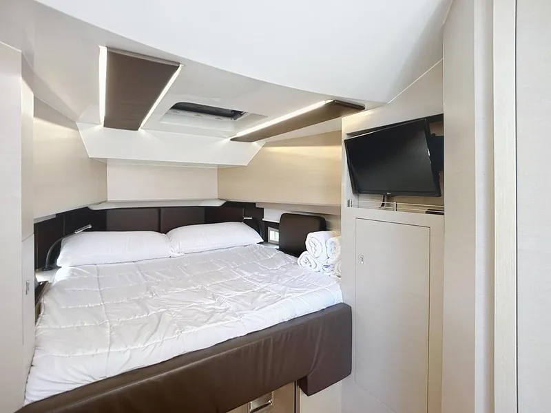 Slide: The Image of Luxurious cabin interior of 2019 SACS Rebel 40 yacht with bed and TV. - 26