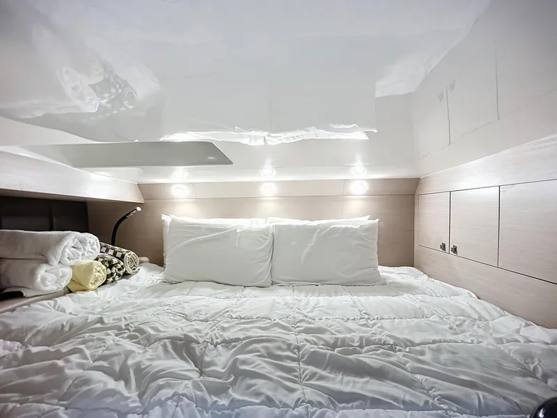 Slide: The Image of Luxurious cabin interior of 2019 SACS Rebel 40 with cozy bedding and ambient lighting. - 29