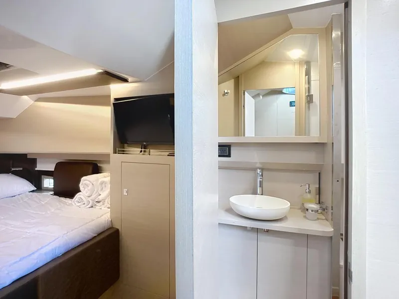 Slide: The Image of Luxurious interior of 2019 SACS Rebel 40 yacht with bedroom and bathroom amenities. - 30