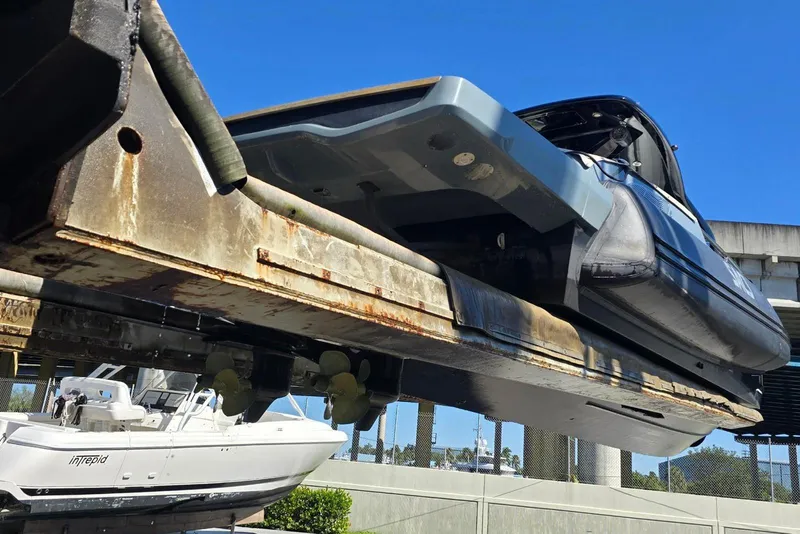 Slide: The Image of 2019 SACS Rebel 40 yacht on a lift, showcasing its sleek design and structure. - 49