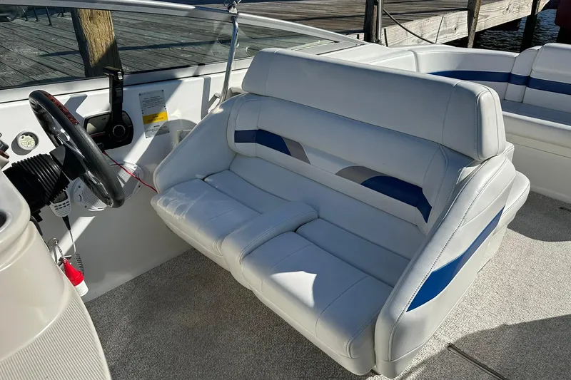 Slide: The Image of 2003 Formula 260 Sun Sport boat interior with white and blue seating. - 11