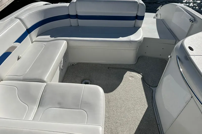 Slide: The Image of 2003 Formula 260 Sun Sport boat interior with white and blue seating. - 13