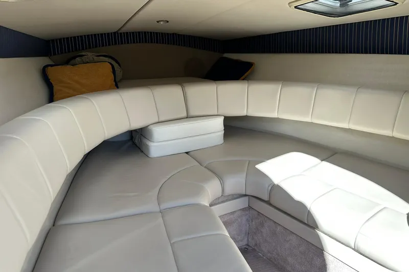 Slide: The Image of Interior of 2003 Formula 260 Sun Sport boat with white cushioned seating. - 15