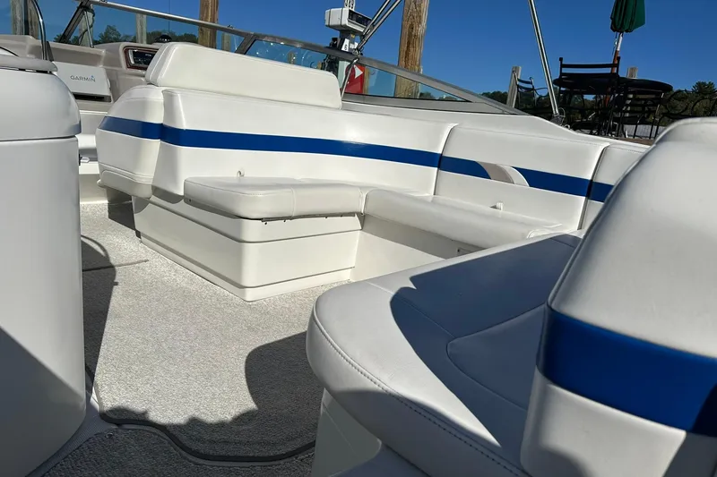 Slide: The Image of 2003 Formula 260 Sun Sport boat interior with white and blue seating. - 6