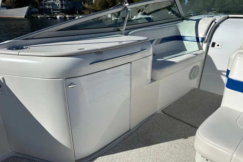 Slide: The Image of 2003 Formula 260 Sun Sport boat interior with white seating and sleek design. - 7