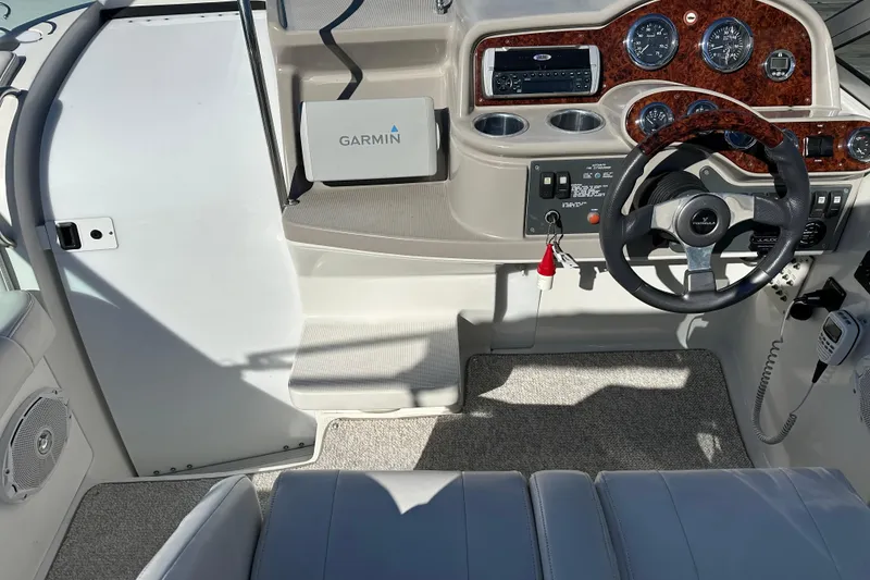 Slide: The Image of 2003 Formula 260 Sun Sport boat dashboard with Garmin GPS and woodgrain panel. - 9