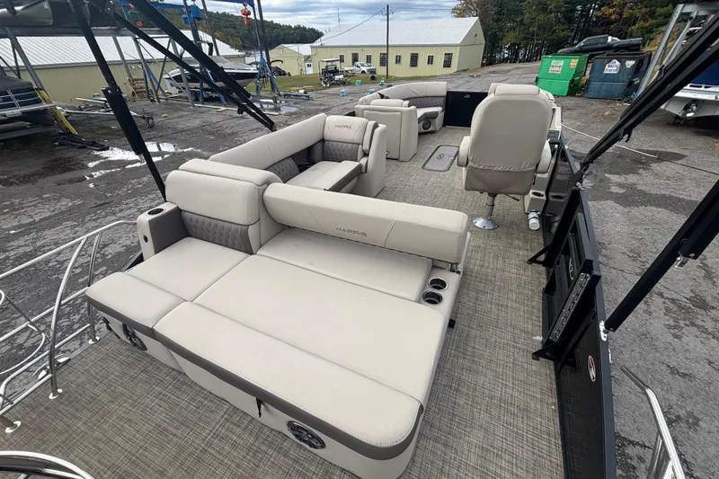 Slide: The Image of 2021 Harris Sunliner 230 pontoon boat with spacious seating and modern design. - 10