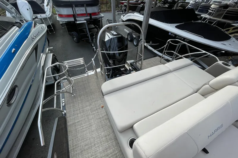 Slide: The Image of 2021 Harris Sunliner 230 boat with spacious seating and modern design. - 14