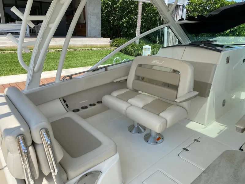 Slide: The Image of 2017 Boston Whaler 320 Vantage boat interior with beige seating and modern design. - 14