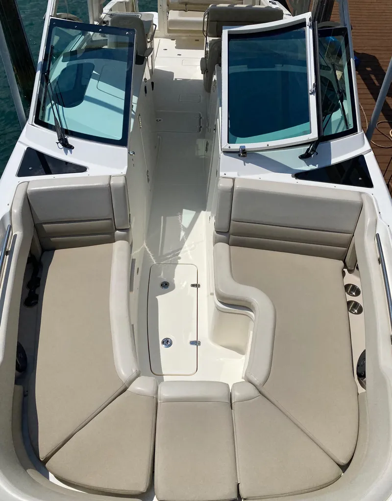 Slide: The Image of 2017 Boston Whaler 320 Vantage boat interior with spacious seating and open deck layout. - 17