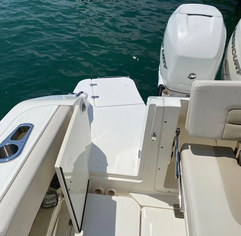 Slide: The Image of Boston Whaler 320 Vantage 2017 boat interior with seating and outboard motor. - 23