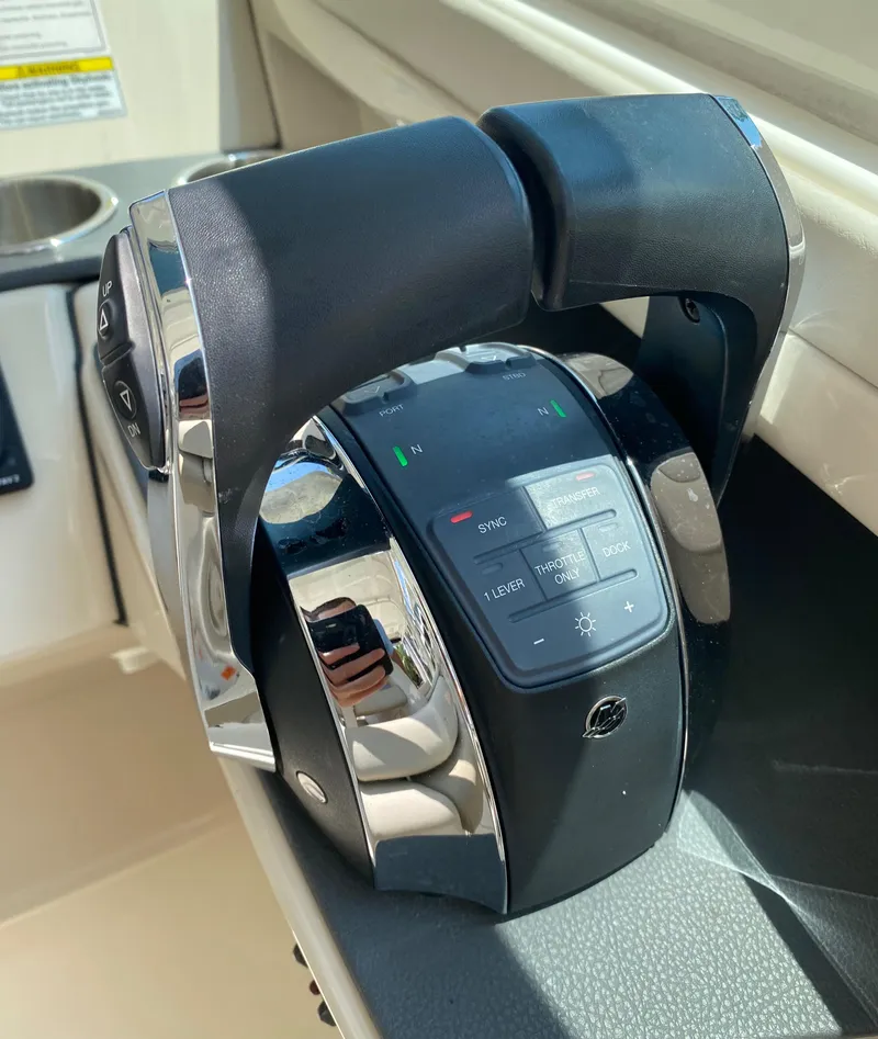 Slide: The Image of Throttle control of a 2017 Boston Whaler 320 Vantage boat, featuring modern design and controls. - 31