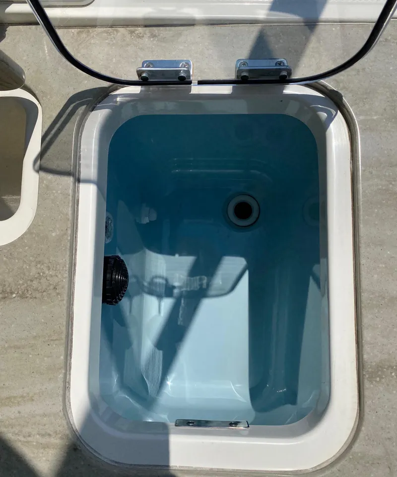 Slide: The Image of Livewell on a 2017 Boston Whaler 320 Vantage boat, open lid view. - 39